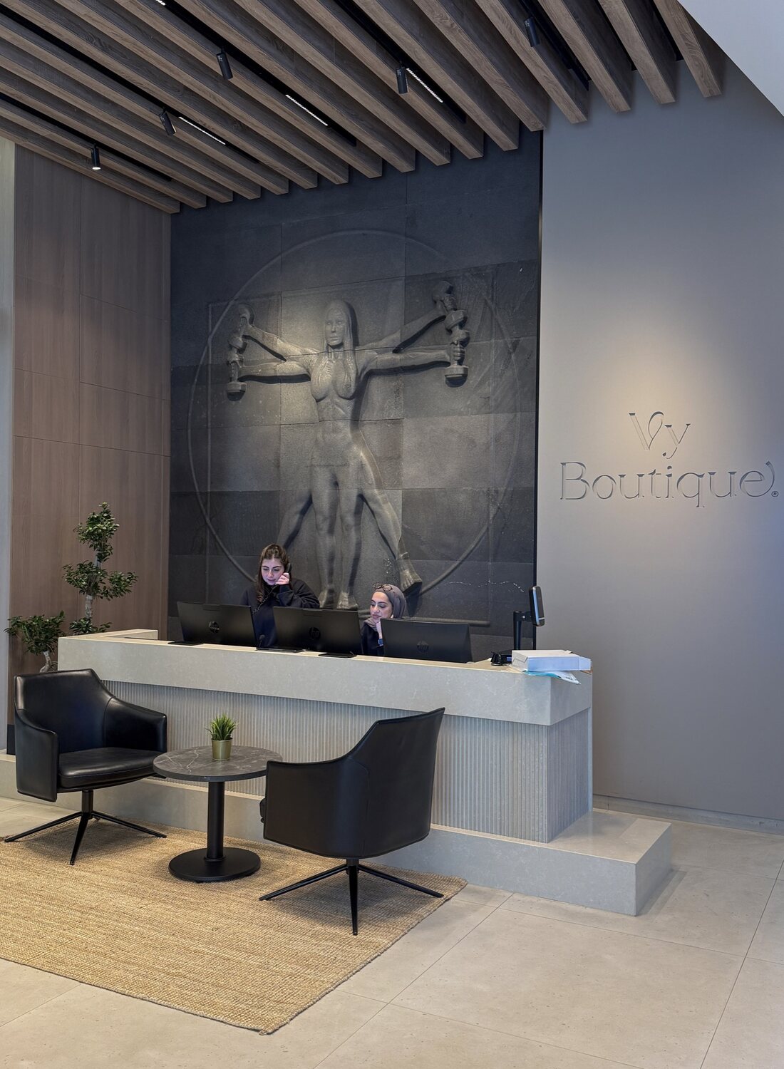The Vy Boutique reception, with the club signage and relief